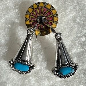 Silver turquoise color drop earrings.